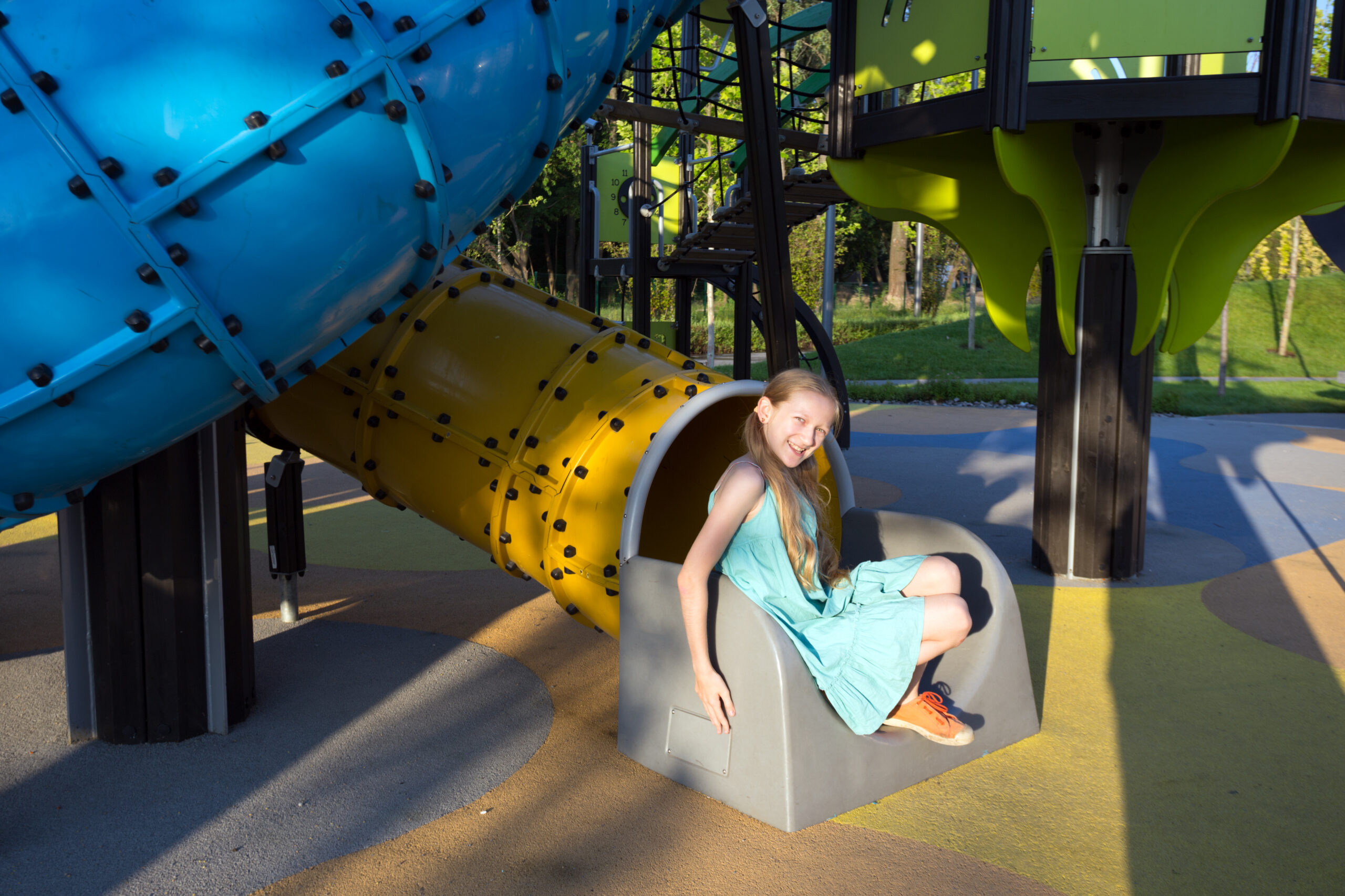girl at the large beautiful playground in the park
