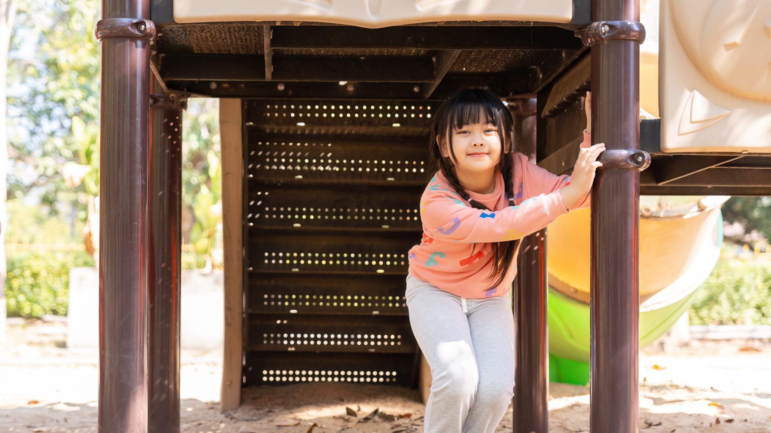 happy children girl playing and having fun at the playground